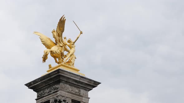 Alexander III bridge on river Seine golden statue details  in Paris France slow tilt 4K 2160p UltraH