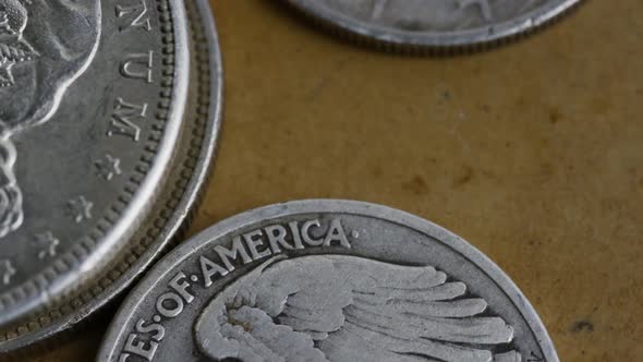 Rotating stock footage shot of antique American coins - MONEY 0109