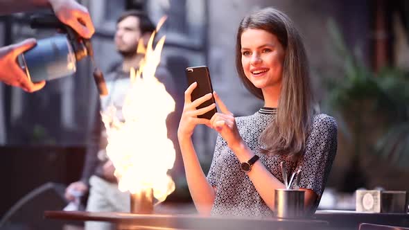 Coffee In Cafe. Woman Making Photo Of Drink Serving With Fire