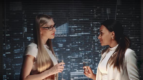 Multiracial Business Women Celebrating Company's Success and Making Cheers