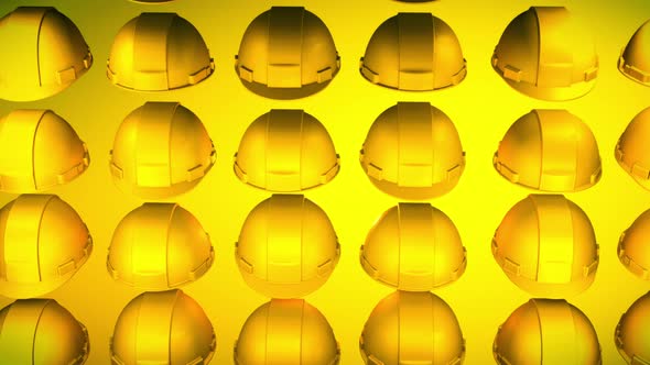 Multiple Yellow headgear hard hats are rotating in the bright glowing background