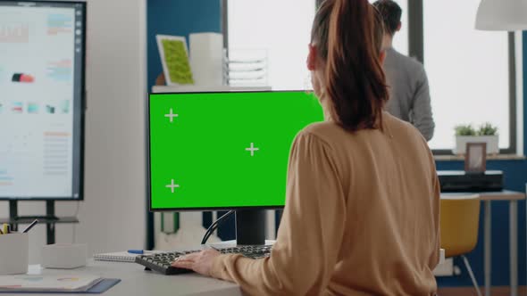 Close Up of Person Using Green Screen on Computer