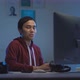 Asian young man working from home at night_26 - VideoHive Item for Sale