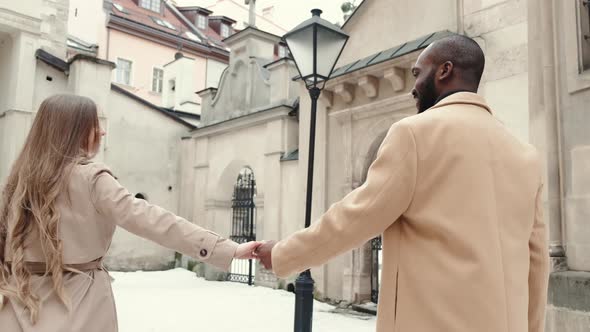 Multi Ethnic Couple Walking the Old City on Women's Day