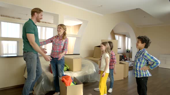 Happy Family Standing Indoors.