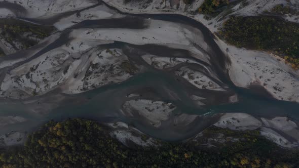 Aerial view Laba river flood forest at dawn, autumn, natural water earth patterns, Caucasus Russia