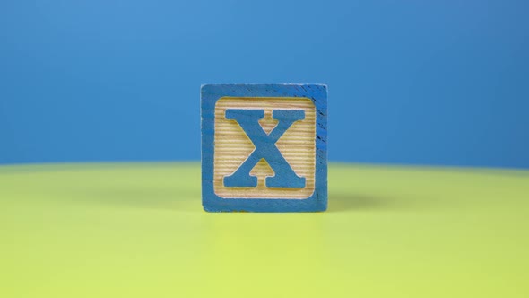 Close up shot letter "X" alphabet wooden block