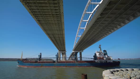 Cargo Ship Passes Under the Crimean Bridge in Kerch