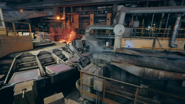 Industrial Machine is Relocating Metal Plates Into Boiling Liquid