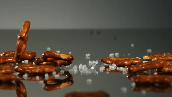 Pretzels falling and bouncing in ultra slow mo 1500fps - reflective surface - PRETZELS
