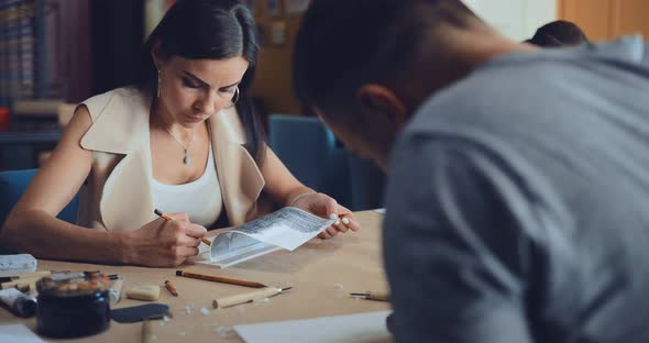 Student Girl Draws a Plastic Tablet in the Classroom