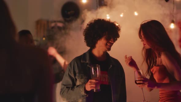 Young Couple Talking During Party