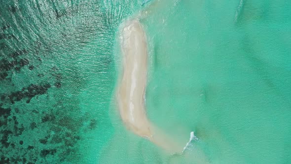 Wide angle overhead island view of a white paradise beach and blue ocean background in best quality 