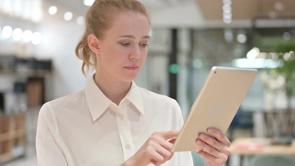 Portrait of Upset Young Businesswoman Having Failure on Tablet 