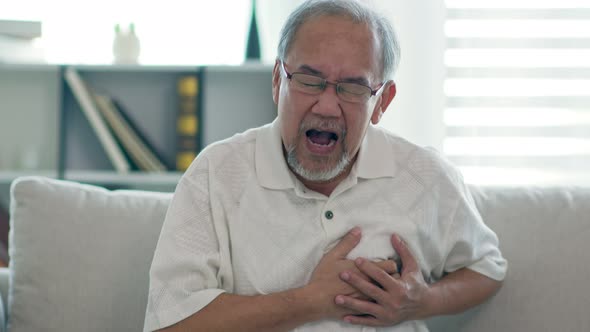 Emergency of Asian Elderly senior man sudden heart attack so pain clutching on chest