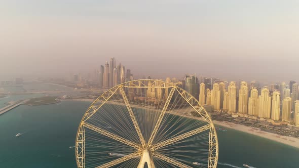 Aerial view passing by of the Ferris wheel under construction, Dubai.