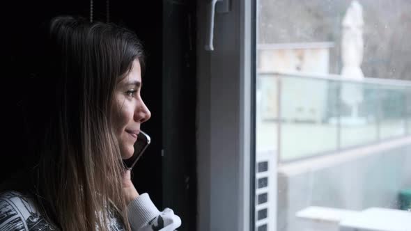 Close Up Young Woman Answers Phone