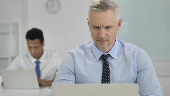 Grey Hair Businessman Upset By Failure at Work