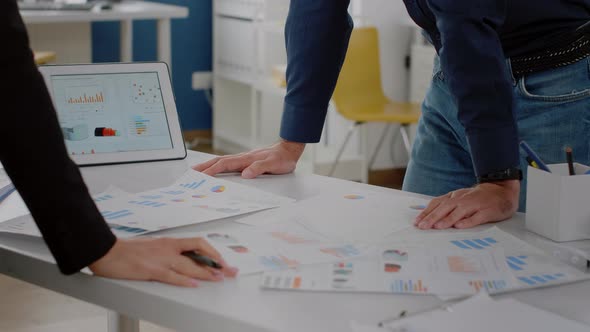 Close Up of Analysis Documents with Data Charts on Desk