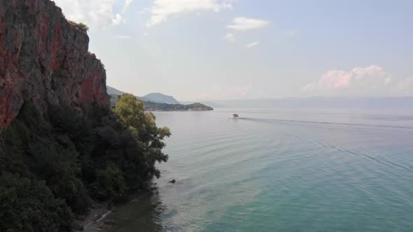 Aerial shot of Macedonia coast. Clif and beautiful water around Ohrid Lake in Southern Europe with b