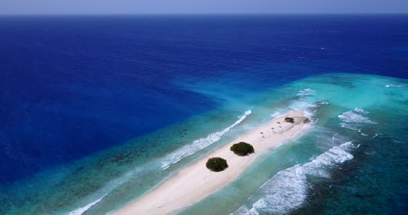 Natural fly over abstract shot of a white sand paradise beach and aqua blue water background in best