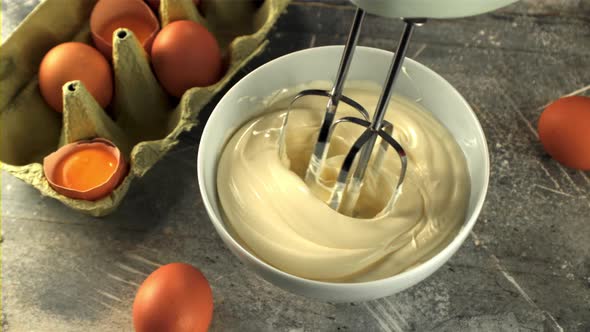 Super Slow Motion Stirring Mayonnaise Mixer Into the Bowl