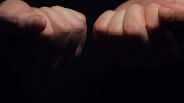 Man Unclenches Fingers with Bitcoin and Litecoin Macro