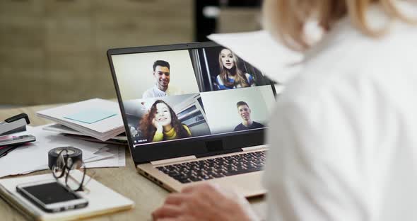 Crop Senior Teacher Making Video Call To Students