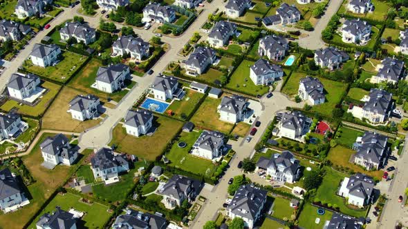 Street with new homes in spring season. Single family houses and residential construction planned co