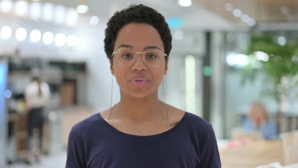 Portrait of Casual African Woman Doing Online Video Call