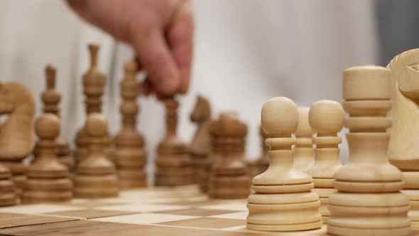 Black Bishop Moves From The Opposite Blurred Side Of A Board