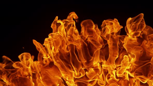 Super Slow Motion Detail Shot of Fire Explosion Against the Black Wall at 1000Fps