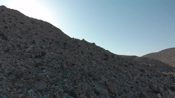 Aerial Dolly Forward up a Rocky Hill