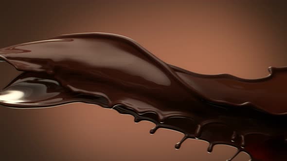 Super Slow Motion Shot of Twisting Chocolate Splash on Brown Gradient Background at 1000 Fps