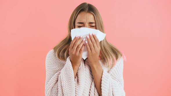 Female in Cardigan and Scarf is Sneezing Into Handkerchief She Caught Cold and Looking Ill While