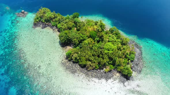 Aerial: flying over tropical island Banda Islands Maluku Indonesia