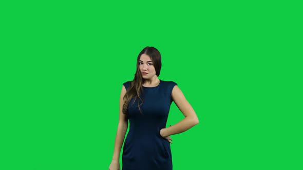 Frustrated annoyed girl in front of a green screen