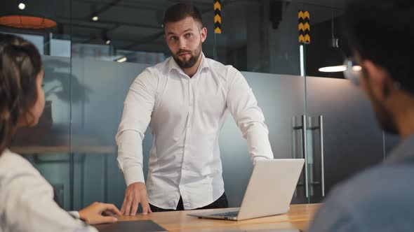 Young Leader Arguing with Employees in Boardroom Dissatisfied Result Work Failed Project Blames