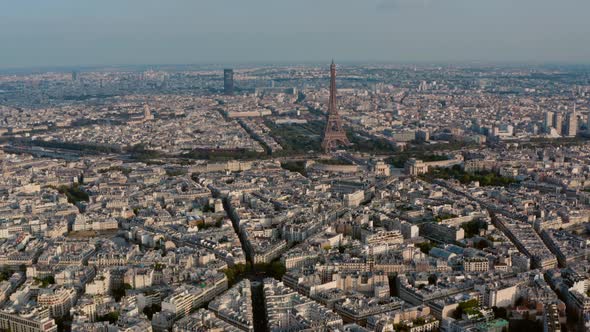 Establishing drone shot of Paris Eiffel Tower Seine river at sunset