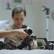 An Asian man is setting a camera rig - VideoHive Item for Sale