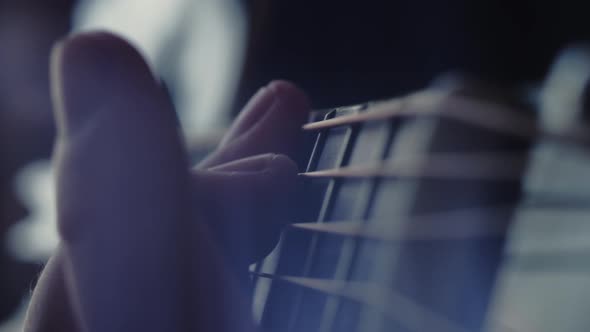 The musician plays the acoustic guitar