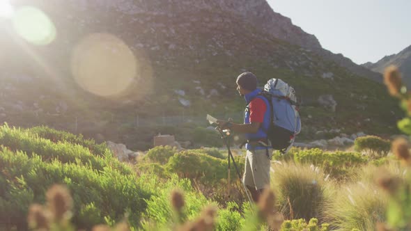 Mixed race man with prosthetic leg hiking in nature