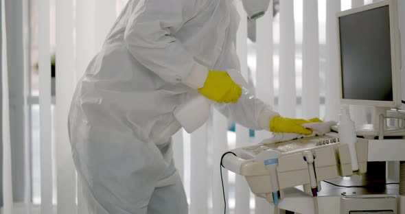 Medical Worker in Ppe Doing Sanitization of Equipment in Hospital Room