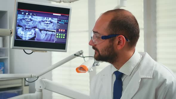 Portrait of Stomatologist Telling the Treatment to Woman