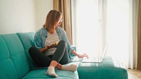 Young Adult Woman Wearing Glasses Relaxing While Working From Home