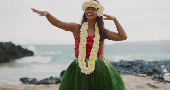 Woman performing Hawaiian hula on the beach