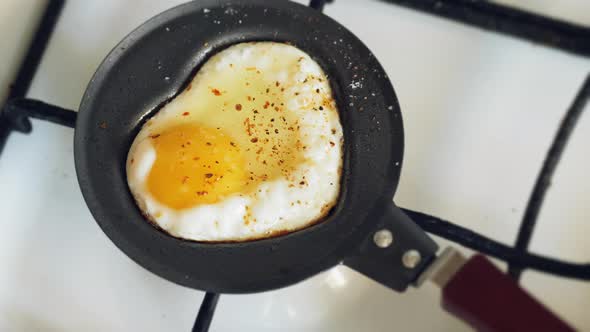 Cooking a Fried Egg on a Mini Pan in the Shape of a Heart