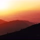 Boundless Mountains with Fog and Hiker Silhouettes at Sunset - VideoHive Item for Sale