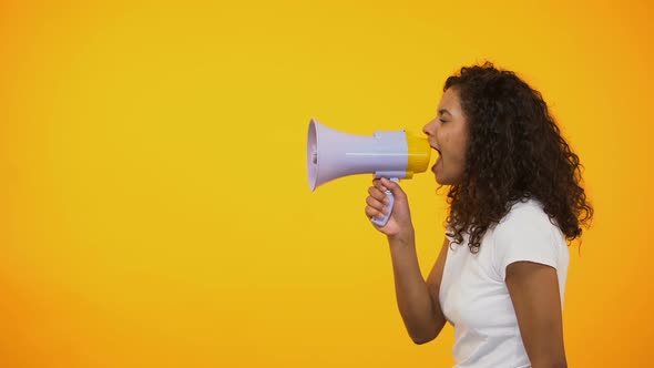 African-American Woman With Megaphone Announcing Sensation News, Shop Discounts