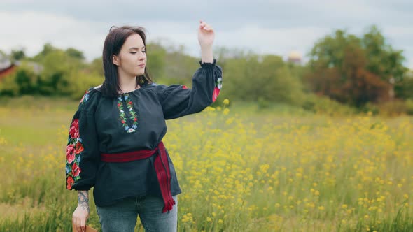 Trendy Brunette Girl Stand in Field Blow Black Colorful Traditional Patterned Shawl at Wind